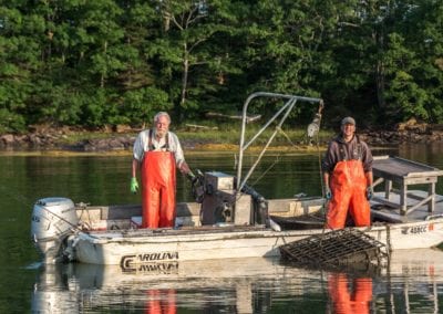 Iron Island Oyster Farmers happy on the waters of New Meadows River in Maine