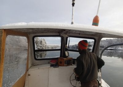 Mill Cove Oyster farmer on water during winter